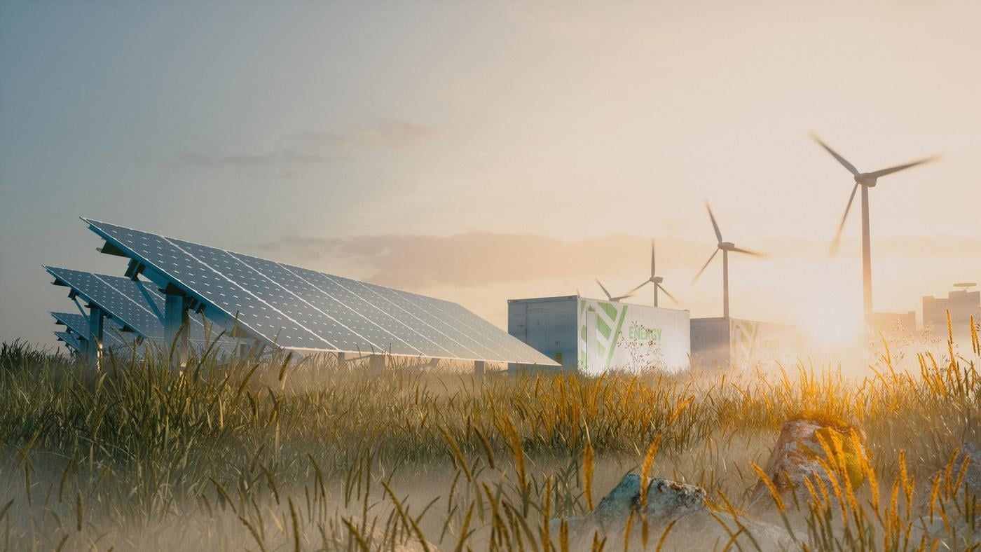 Concept of renewable energy solution in beautiful morning light. Installation of solar power plant, container battery energy storage systems, wind turbine farm and city in background. 3d rendering.