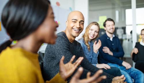 Group of diverse business people talking in a meeting. Business team smiling during a meeting.