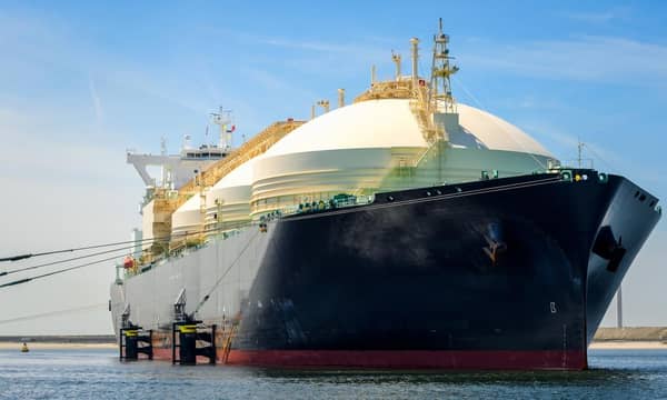 Low angle view of a large natural gas carrier ship in a harbour on a clear summer day. Port of Rotterdam, the Netherlands.