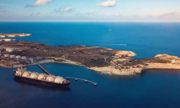A Liquefied Natural Gas (LNG) tanker moored to the jetty close to a power station.