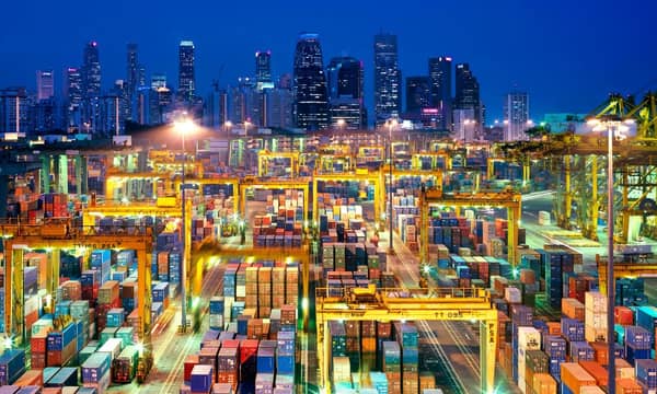 Busy container port at night in Hong Kong.