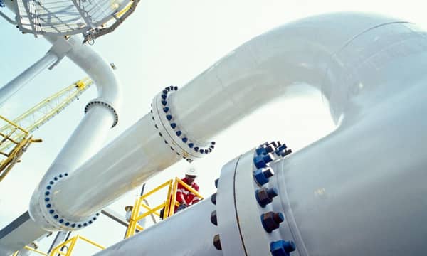 Worker on HP Separator, FPSO offshore, Angola. Floating Production Storage and Offloading units house both processing equipment and storage for produced hydrocarbons.