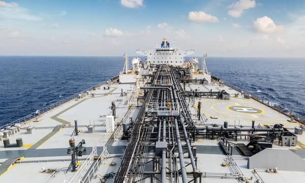 The deck of a large oil tanker in the ocean.