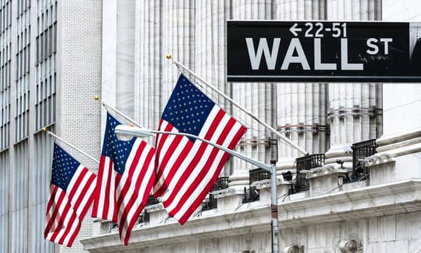 US flags outside the New York Stock Exchange, Wall street, Manhattan, New York, USA.