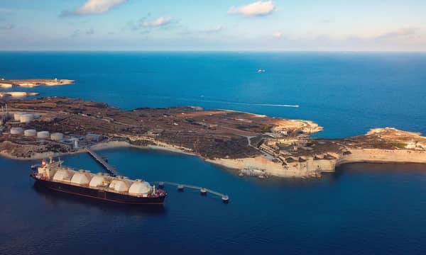 A Liquefied Natural Gas (LNG) tanker moored to the jetty close to a power station.
