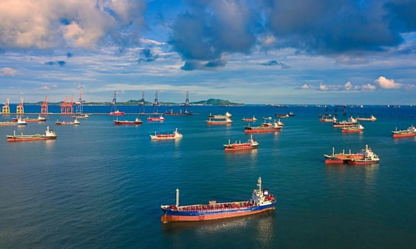 Aerial view Oil ship tanker waiting load or unload oil at loading dock from refinery on the sea.