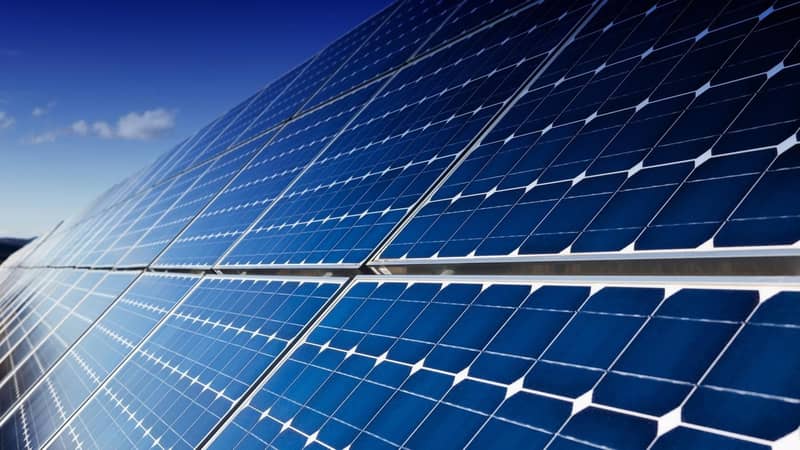 A close-up of a row of solar panels.