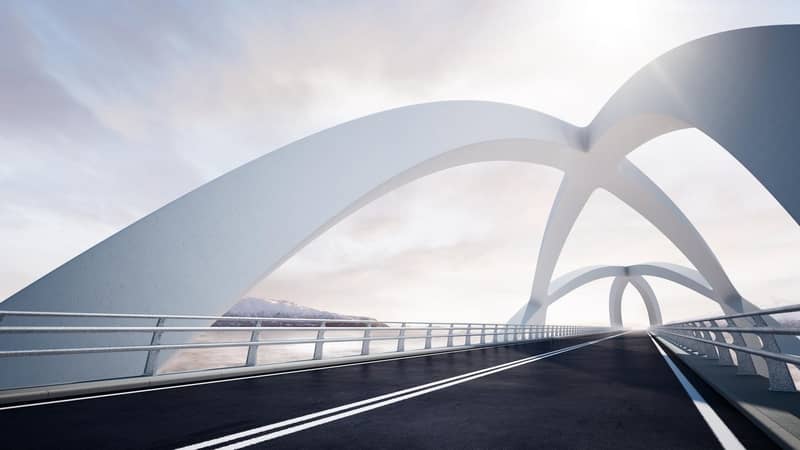 Modern curved architectural white bridge, against a backdrop of a river and mountain landscape on the left.