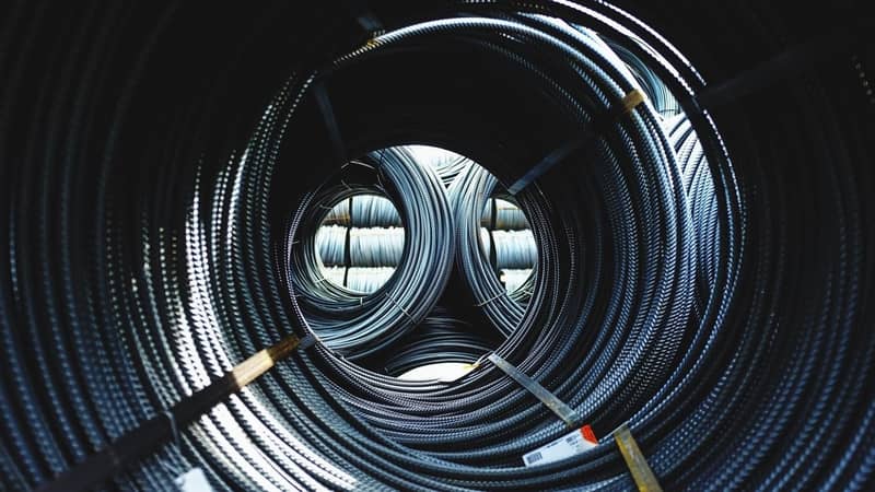 Bound roped steel in a warehouse.
