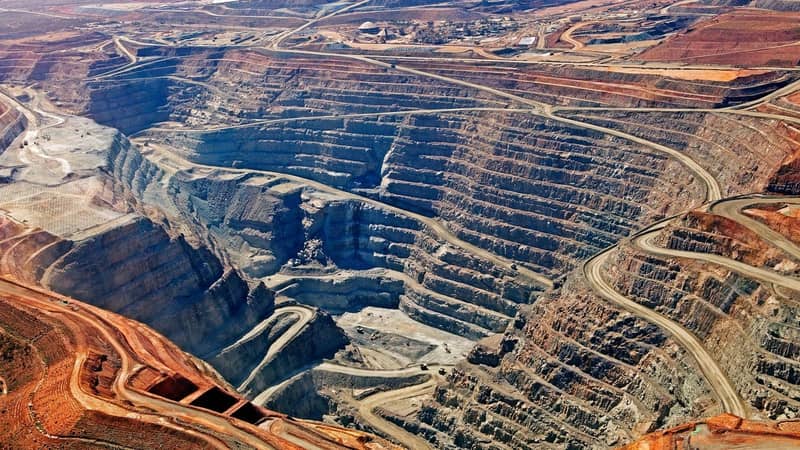 A vast and deep quarry site.