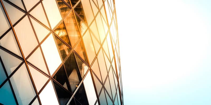 Close up of the Gherkin building exterior seen from below, one of the most recognizable skyscrapers in London.