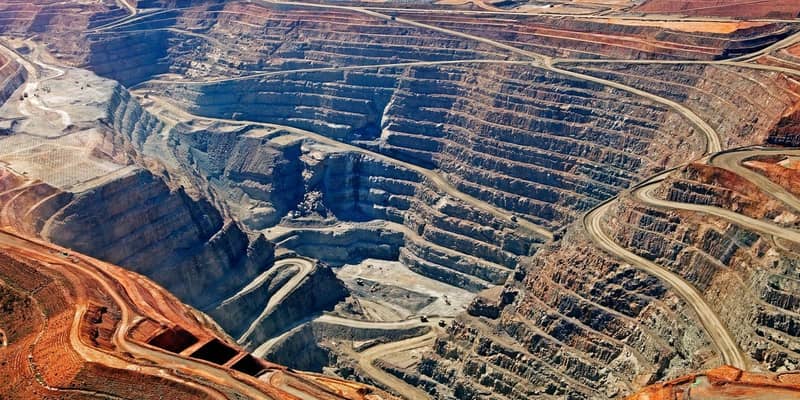 A vast and deep quarry site.