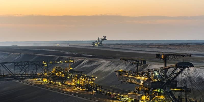 An open pit mine at dusk.