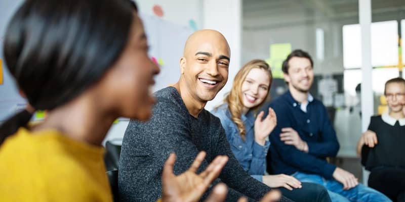 Group of diverse business people talking in a meeting. Business team smiling during a meeting.