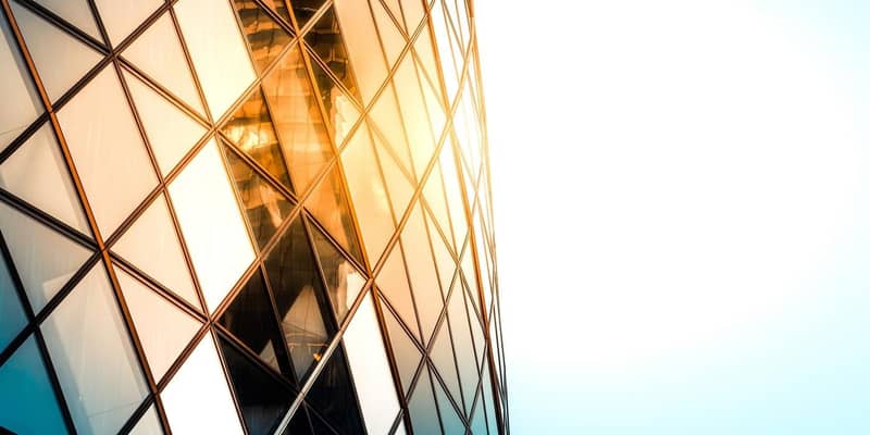 Close up of the Gherkin building exterior seen from below, one of the most recognizable skyscrapers in London.