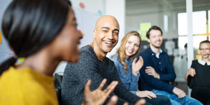 Group of diverse business people talking in a meeting. Business team smiling during a meeting.