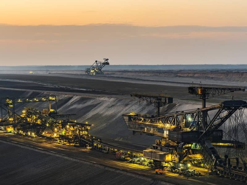 An open pit mine at dusk.