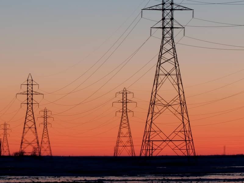 Electricity pylons at sunset.