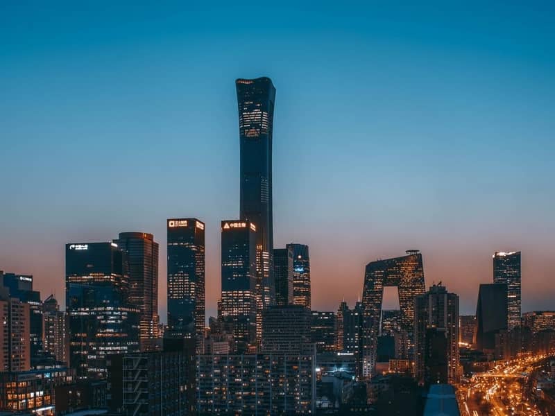 China World Trade Center and surrounding buildings at dusk, with a clear blue-red sunset. Beijing, China.