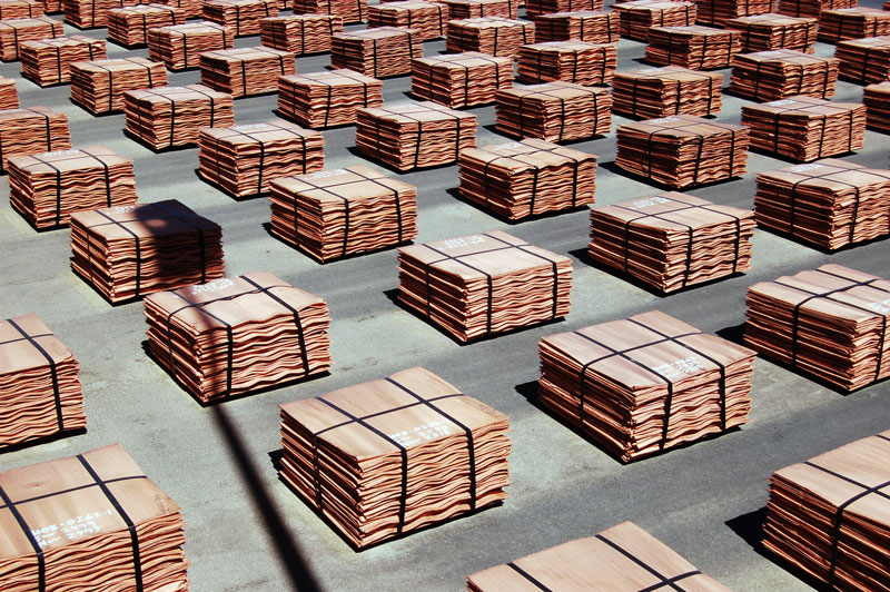 copper plate stacked in bales on a factory floor