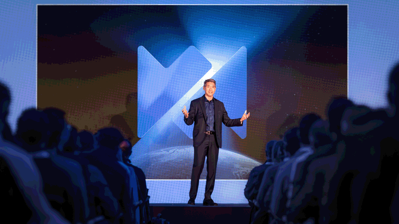 Jason Liu, CEO, Wood Mackenzie on stage at event