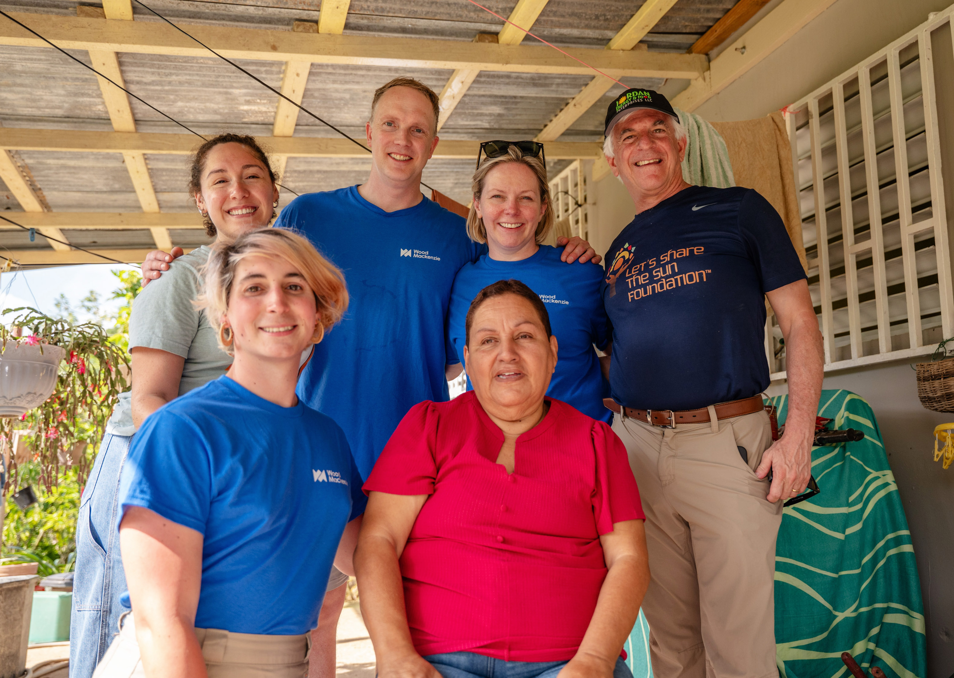 Wood Mackenzie volunteers with Doña Ana at her home in Puerto Rico. 