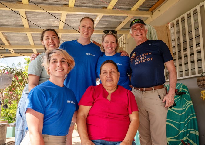 Wood Mackenzie volunteers with Doña Ana at her home in Puerto Rico. 
