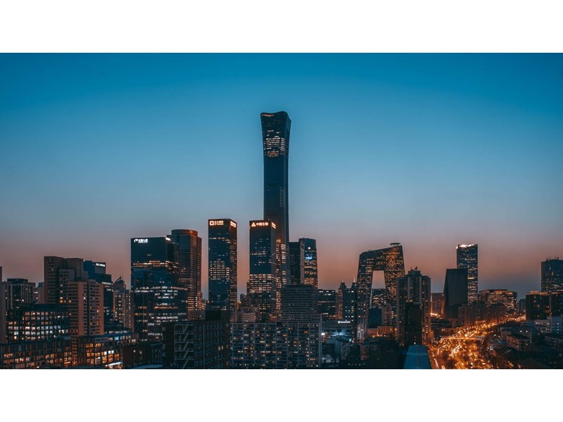 China World Trade Center and surrounding buildings at dusk, with a clear blue-red sunset. Beijing, China.