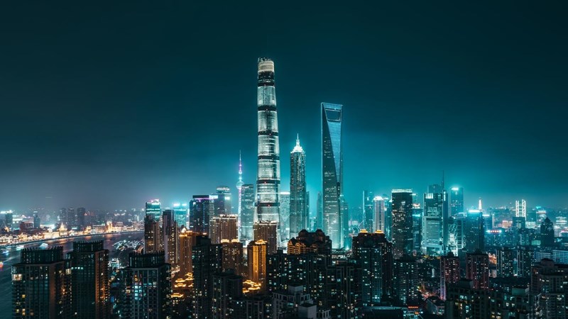 Illuminated Skyscrapers in Shanghai at night, showing Lujiazui CBD in Pudong District with Oriental Pearl Tower, Shanghai International Finance Center, Jin Mao Tower, Shanghai World Financial Center and Shanghai Tower. Shanghai, China.