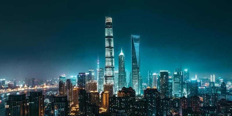 Illuminated Skyscrapers in Shanghai at night, showing  Lujiazui CBD in Pudong District with Oriental Pearl Tower, Shanghai International Finance Center, Jin Mao Tower, Shanghai World Financial Center and Shanghai Tower. Shanghai, China.