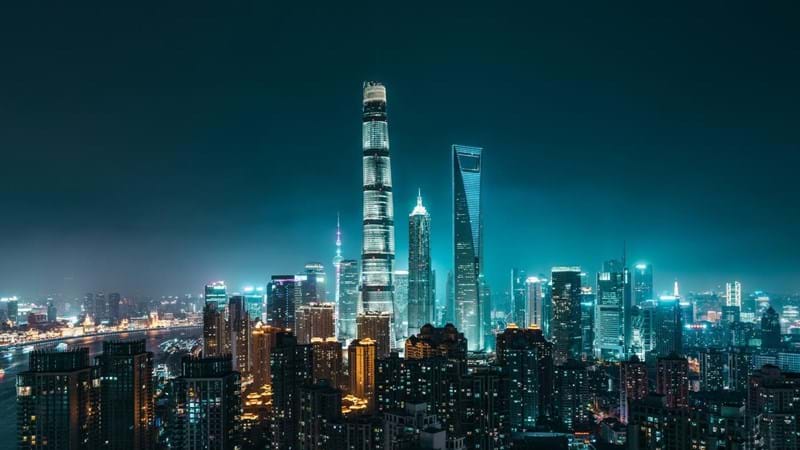 Illuminated Skyscrapers in Shanghai at night, showing  Lujiazui CBD in Pudong District with Oriental Pearl Tower, Shanghai International Finance Center, Jin Mao Tower, Shanghai World Financial Center and Shanghai Tower. Shanghai, China.
