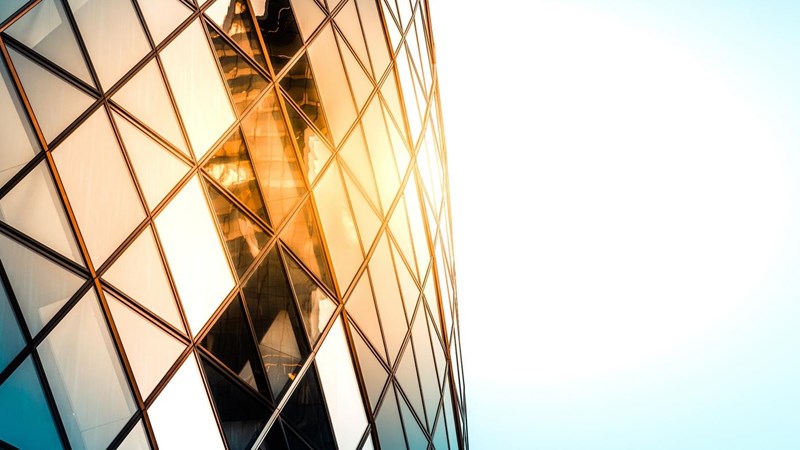Close up of the Gherkin building exterior seen from below, one of the most recognizable skyscrapers in London.