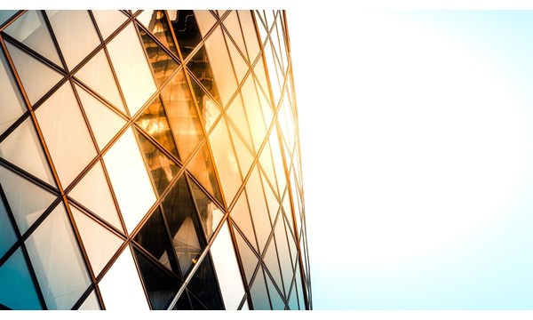 Close up of the Gherkin building exterior seen from below, one of the most recognizable skyscrapers in London.