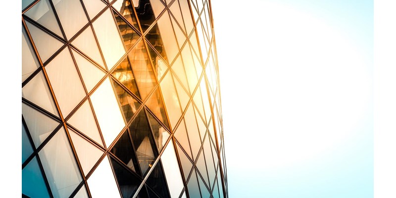 Close up of the Gherkin building exterior seen from below, one of the most recognizable skyscrapers in London.