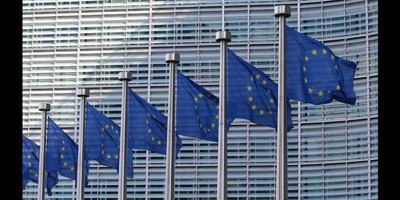 A row of EU flags rippling in the breeze, outside the Parliament Building, Strasbourg, France.