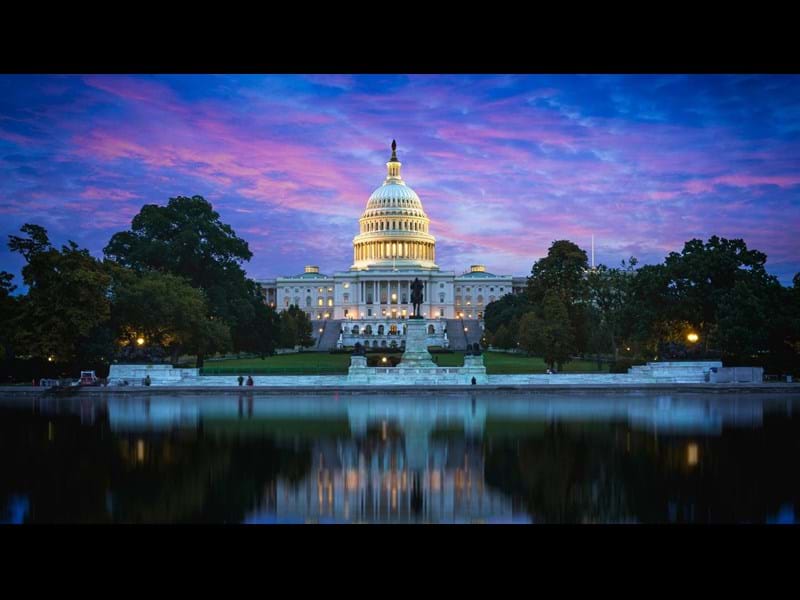 Capitol Hill Building and reflection in the Capitol Lake, at dusk. Washington DC, USA.