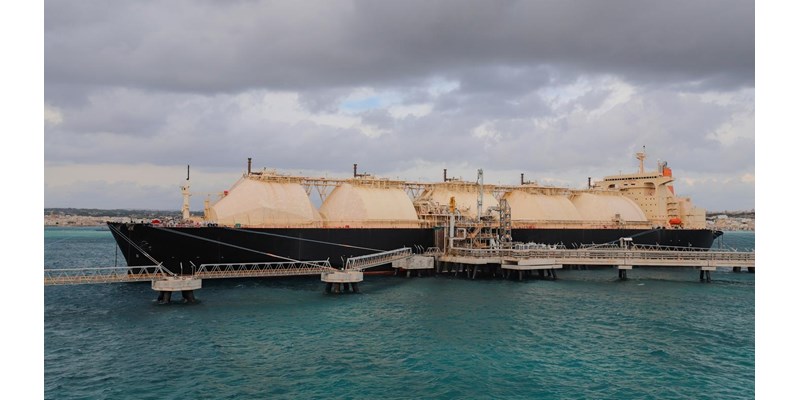 A Liquified Natural Gas Floating Storage Unit delivers LNG to the onshore regasification plant feeding natural gas to the power plant.