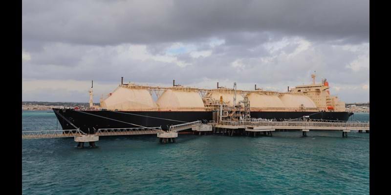 A Liquified Natural Gas Floating Storage Unit delivers LNG to the onshore regasification plant feeding natural gas to the power plant.