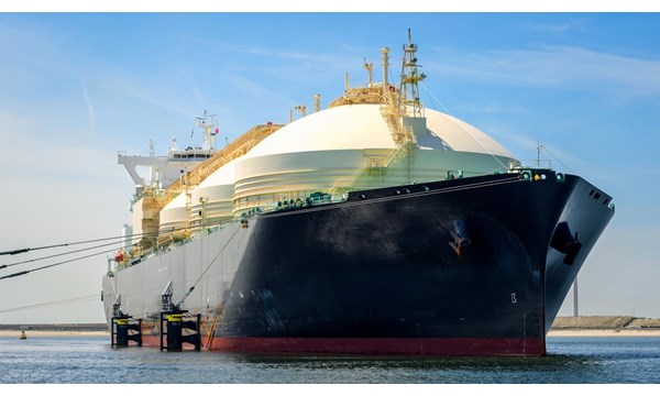 Low angle view of a large natural gas carrier ship in a harbour on a clear summer day. Port of Rotterdam, the Netherlands.
