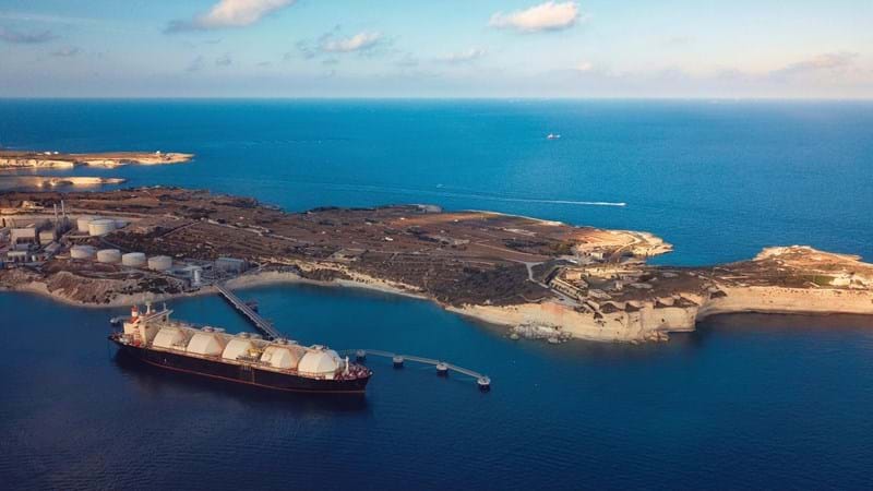 A Liquefied Natural Gas (LNG) tanker moored to the jetty close to a power station.