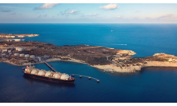 A Liquefied Natural Gas (LNG) tanker moored to the jetty close to a power station.