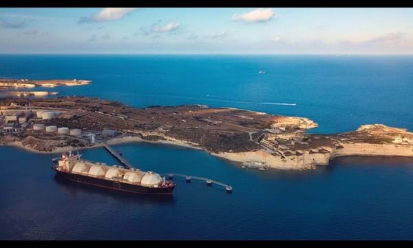 A Liquefied Natural Gas (LNG) tanker moored to the jetty close to a power station.