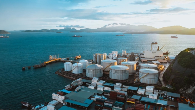 Oil tankers and oil tanks in port at night