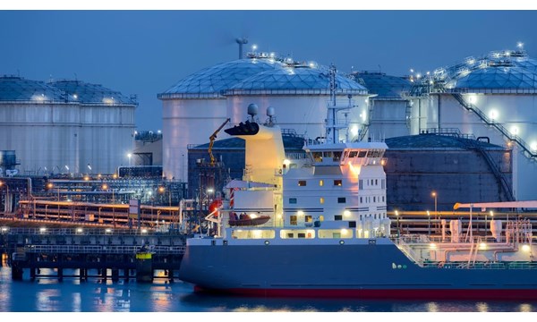Liquid Natural Gas storage tanks and tanker at dusk, Port of Rotterdam.