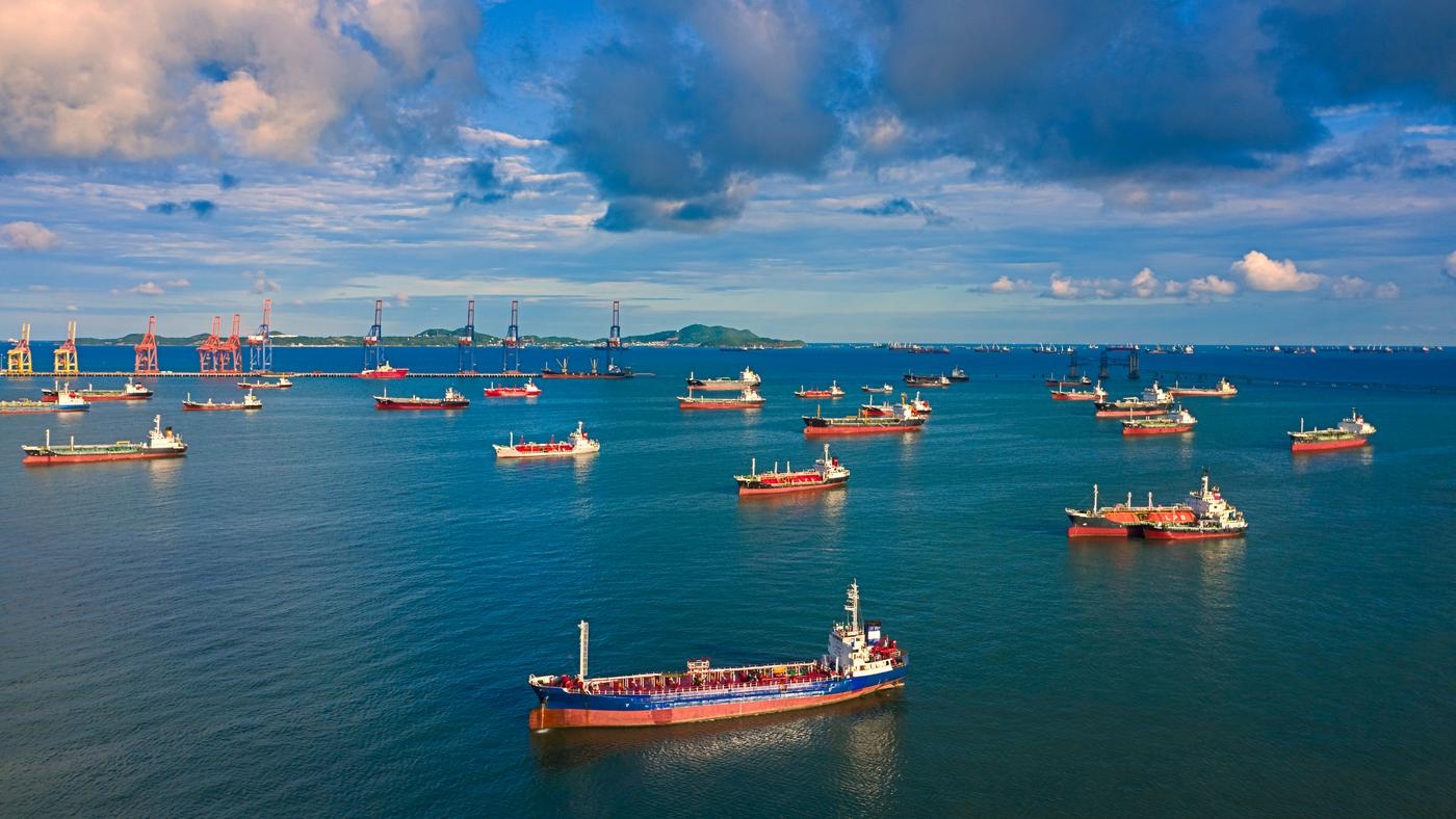 Aerial view Oil ship tanker waiting load or unload oil at loading dock from refinery on the sea.