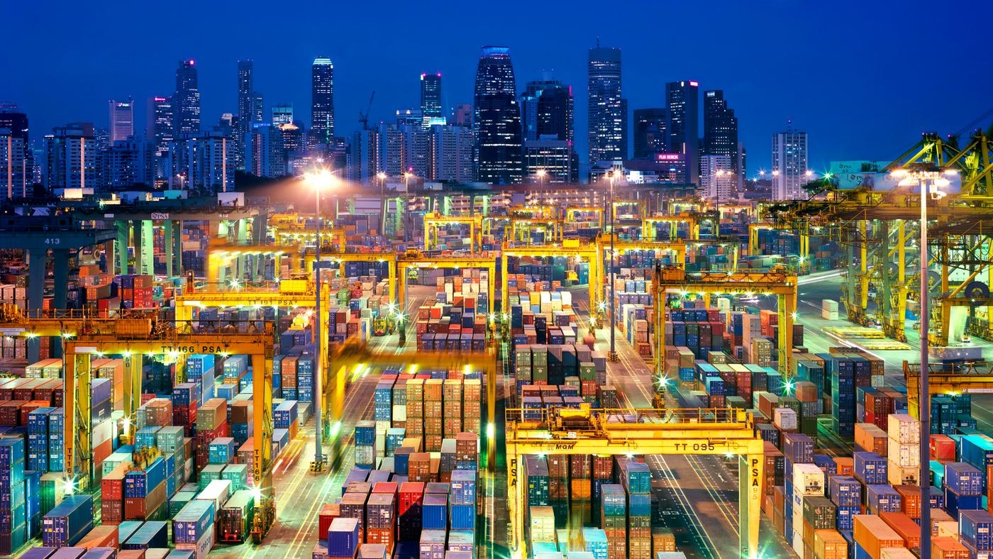 Busy container port at night in Hong Kong.
