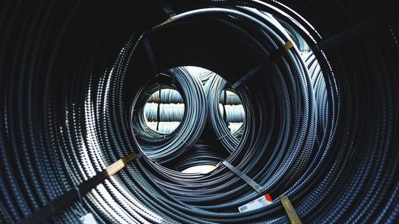 Bound roped steel in a warehouse.