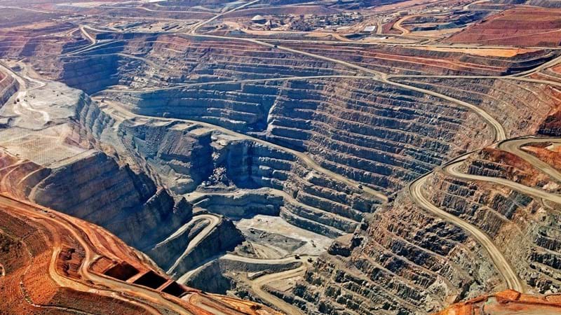 A vast and deep quarry site.