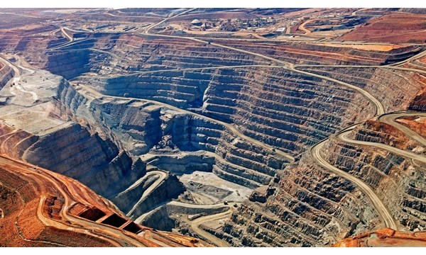 A vast and deep quarry site.