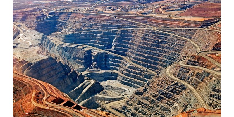 A vast and deep quarry site.